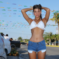 Lovely Melena Maria Rya showing off her long legs outdoors
