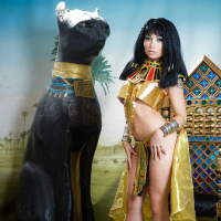 Brunette coed Rina Ellis peeling off Cleopatra themed cosplay outfit