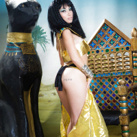 Brunette coed Rina Ellis peeling off Cleopatra themed cosplay outfit
