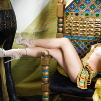 Brunette coed Rina Ellis peeling off Cleopatra themed cosplay outfit