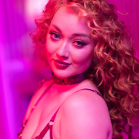 Curly beauty Emma Magnolia strips naked while playing with sextoys