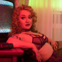 Curly beauty Emma Magnolia strips naked while playing with sextoys