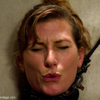 A straight jacket restrained Ariel X receives electroshock on bald pussy