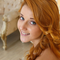 Redhead glamour babe Roberta Berti spreading shaved teen vagina