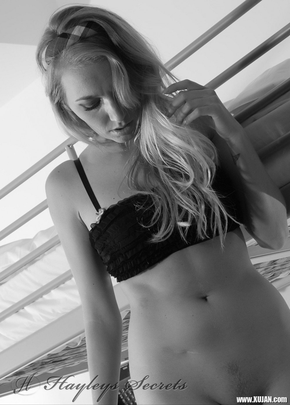 Hayley Marie Coppin takes off her plaid skirt while posing in the bedroom - Photo #687481