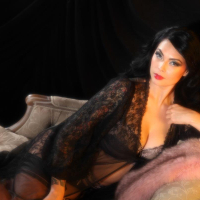 Hot Tera Patrick posing in Black Lingerie on Couch