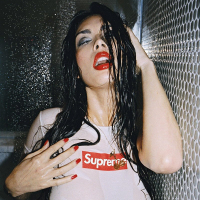 Tera Patrick posing and getting her Tshirt wet