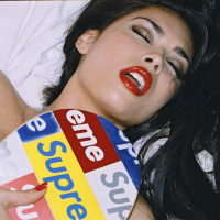 Tera Patrick posing and getting her Tshirt wet
