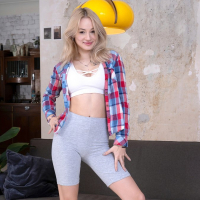 Busty teen beauty Marilyn Rougee strips and shows her shaved pussy on couch