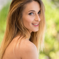 Gorgeous Cara Mell spreads wide on the couch
