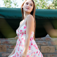 Sonya Blaze strips off her summer dress in the backyard