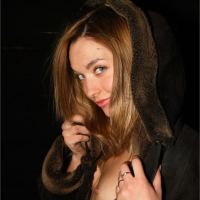Sweet Lilya wearing sheepskin coat over nude body