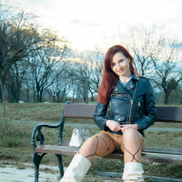 Foxy redhead Jeny Smith shows her sexy legs during winter walk