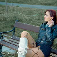 Foxy redhead Jeny Smith shows her sexy legs during winter walk