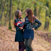 Hot Jeny Smith and her friend posing in pantyhose outdoors