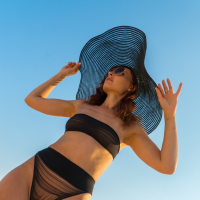 Sweet chick Jeny Smith posing in a black bikini outdoors