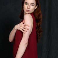Sexy redhead babe Loren Sun strips naked exposing shaved snatch
