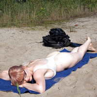 Casey Deluxe does a strip tease and then heads over to the sauna and beach