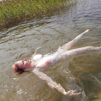Casey Deluxe takes a swim and wears some seductive clothing