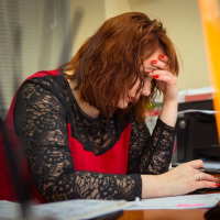 Redhead Katrin Porto teasing with her curvy body in the office