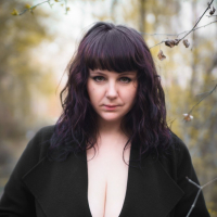 Katrin Porto teasing with her big tits and hairy pussy outdoors