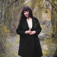 Katrin Porto teasing with her big tits and hairy pussy outdoors