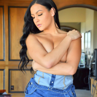 Mila Monet seductively strips and teases on camera