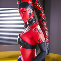 Cosplay model Kleio Valentien exhibiting pink pussy in long latex boots