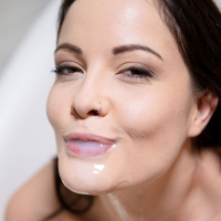 Horny Dolly Diore taking a milk bath with a dildo
