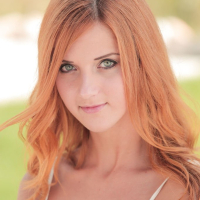 Erotic redhead Roberta Berti showing shaved Pussy