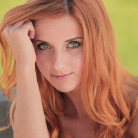 Erotic redhead Roberta Berti showing shaved Pussy
