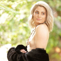 Nella Jones gets comfortably nude in the backyard