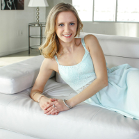 Blonde teener Rachel James posing fully clothed in white dress