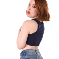 Seductive redhead cutie Lottie Magne gets naked and shows hot smooth ass