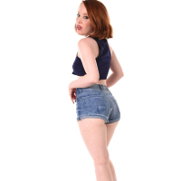 Seductive redhead cutie Lottie Magne gets naked and shows hot smooth ass