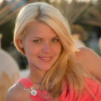 CUte blonde posing in white lingerie in the sunset