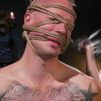 Bella Rossi takes control over tied up male slave