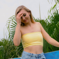Slim blonde Emma Sirus gets naked and unveils her small boobs