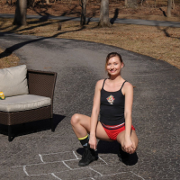 Shameless young babe Emma Sirus toys her twat and squirts in the driveway
