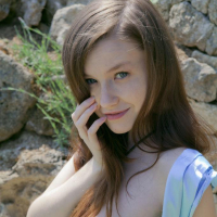 Emily Bloom bares her flawless body by the rocks