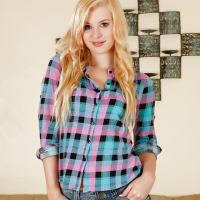 Undressing blonde teen Charlyse Angel demonstrates her long legs