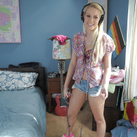 Horny babe Vanessa Cage stripping and teasing her cunt under her shorts