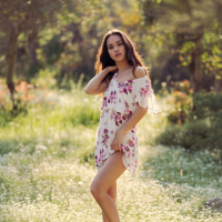 Kit Rysha sits in a Field with her tiny Boobs out