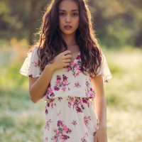Kit Rysha sits in a Field with her tiny Boobs out