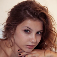 Redhead teen Emma Sweet strips naked for you in Kinere