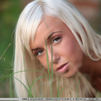 sweet blonde Emma shows off in the backyard