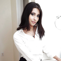 Brunette babe Jade Jantzen posing fully clothed in white blouse and skirt