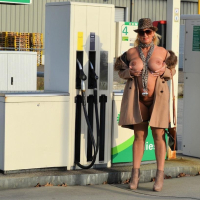 Busty Nude Chrissy goes for a naturist walk wearing only a fur coat