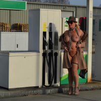Busty Nude Chrissy goes for a naturist walk wearing only a fur coat
