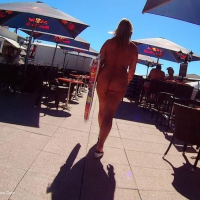 Nude Chrissy walking around a Nudist Resort